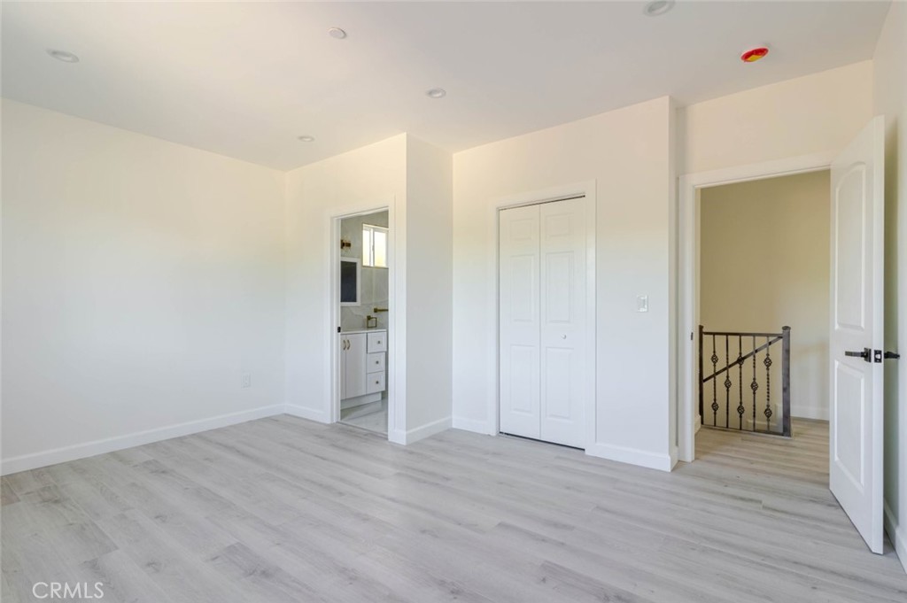 17428 Roscoe Boulevard Northridge, CA 91325 - Photo 18 of 24 a view of hallway with wooden floor