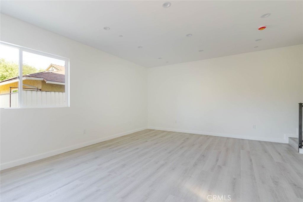 17428 Roscoe Boulevard Northridge, CA 91325 - Photo 22 of 24 an empty room with a window