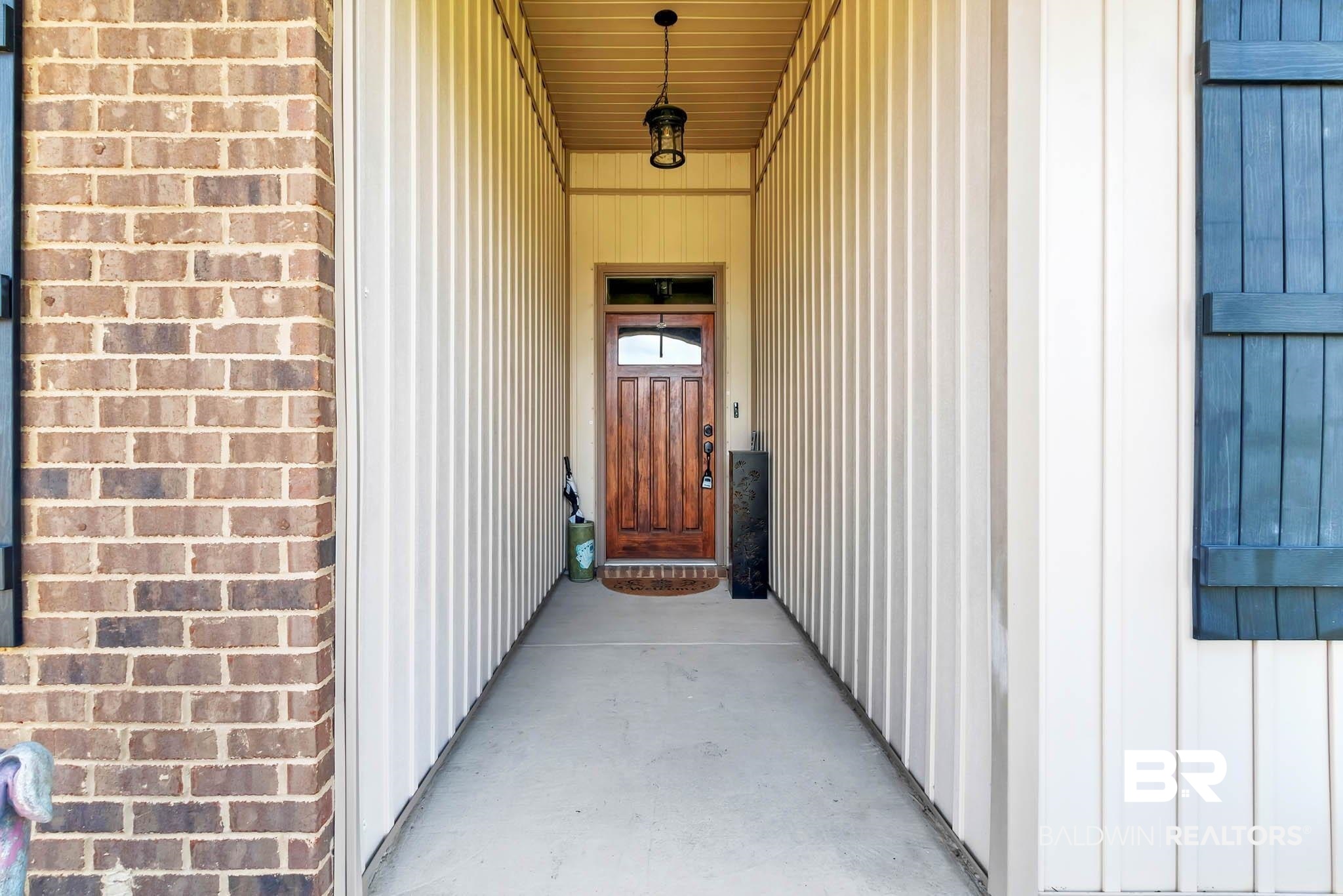 2049 Bourbon Street Foley, AL 36535 - Photo 7 of 56 Entrance to property featuring board and batten siding