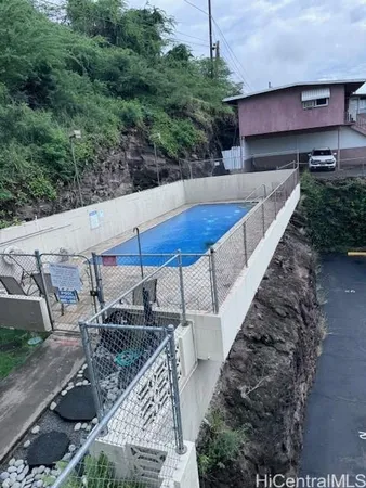 a view of a swimming pool with a patio