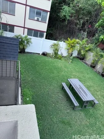 a view of a backyard with sitting area