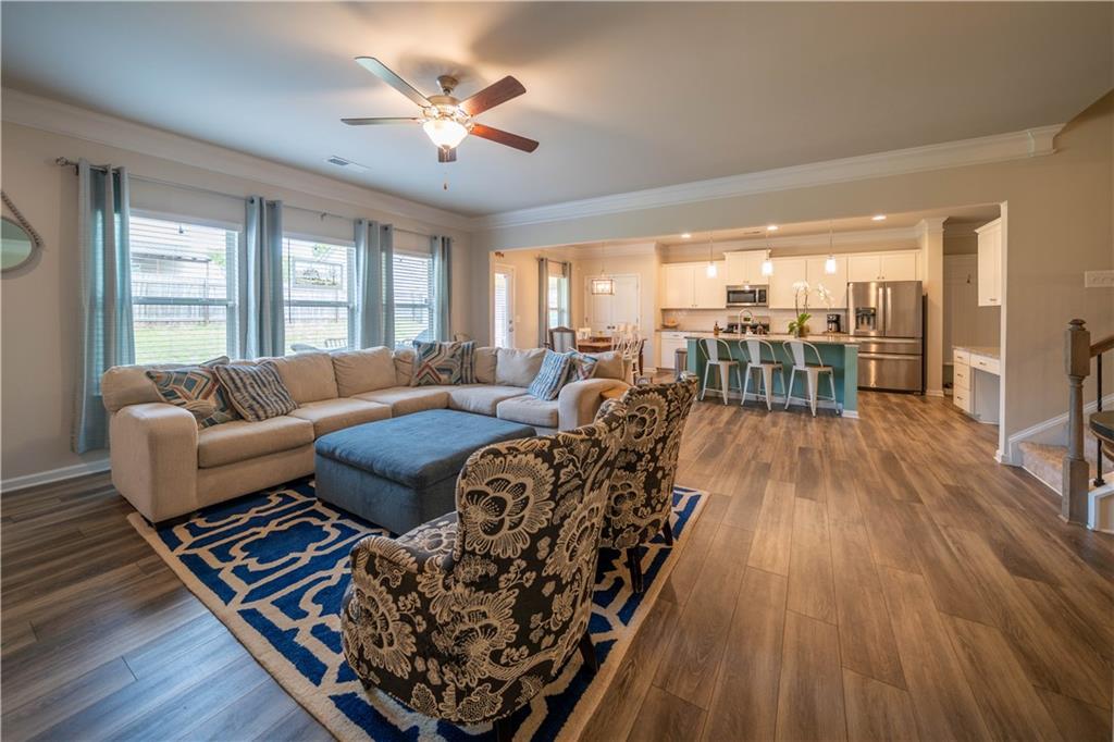 172 Mercer Lane Cartersville, GA 30120 - Photo 11 of 44 a living room with furniture rug and wooden floor