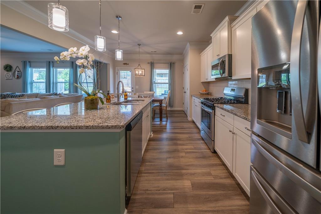 172 Mercer Lane Cartersville, GA 30120 - Photo 14 of 44 a large kitchen with granite countertop lots of counter top space