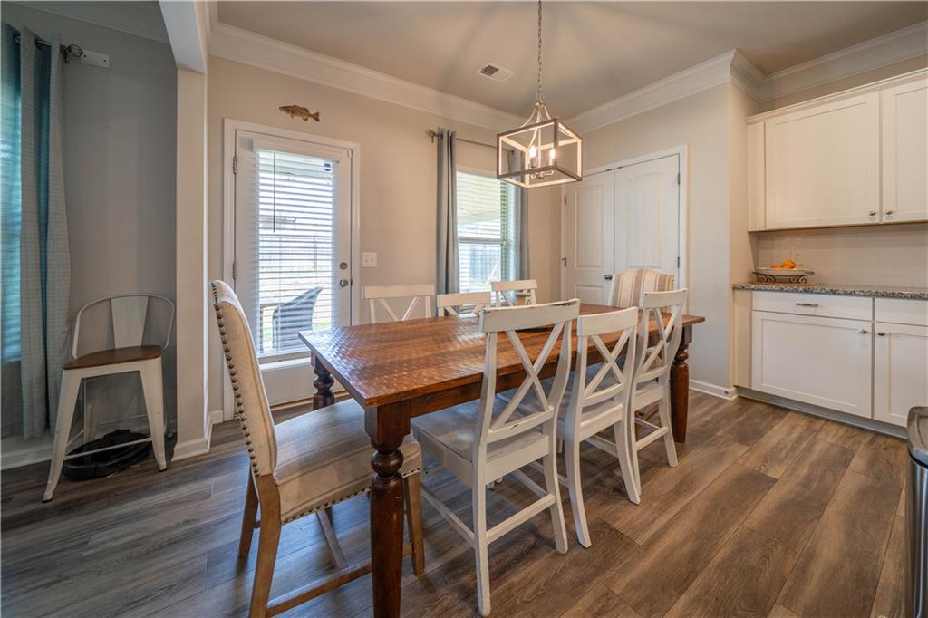 172 Mercer Lane Cartersville, GA 30120 - Photo 17 of 44 a view of a dining room with furniture window and wooden floor