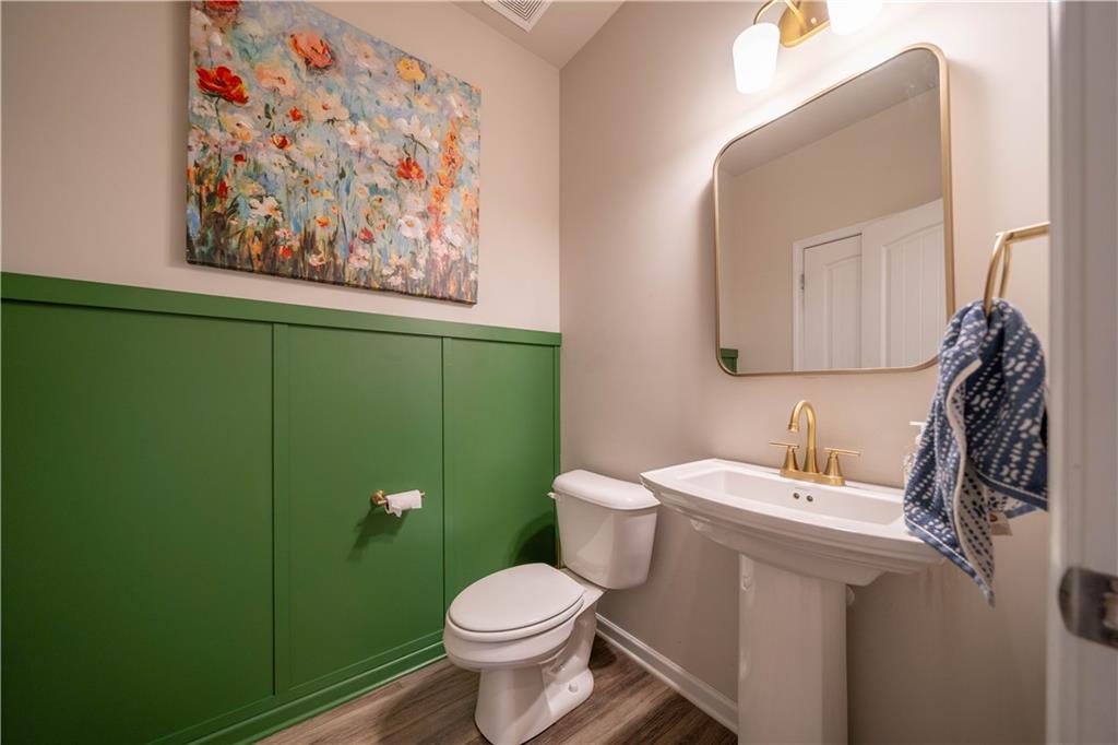 172 Mercer Lane Cartersville, GA 30120 - Photo 21 of 44 a bathroom with a toilet sink and mirror