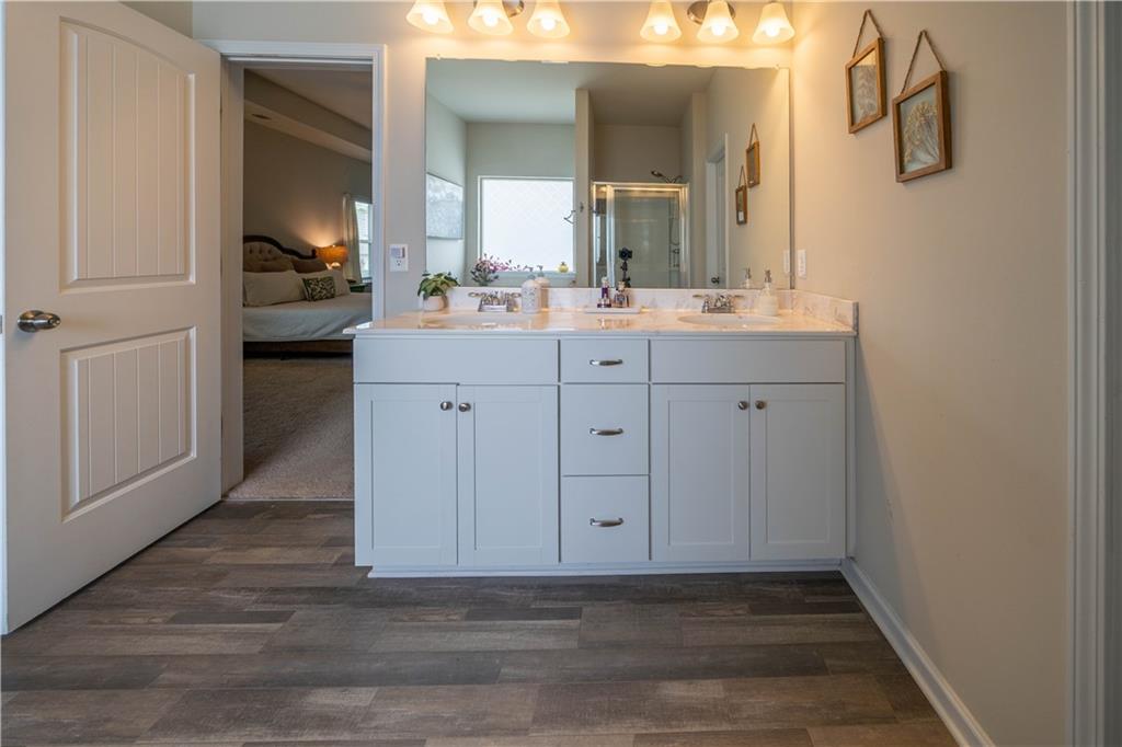 172 Mercer Lane Cartersville, GA 30120 - Photo 26 of 44 a bathroom with a sink and a mirror