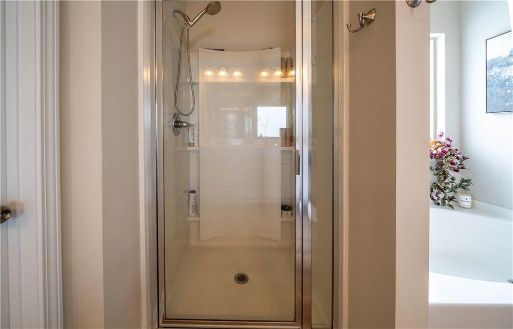 172 Mercer Lane Cartersville, GA 30120 - Photo 27 of 44 a bathroom with a glass shower door