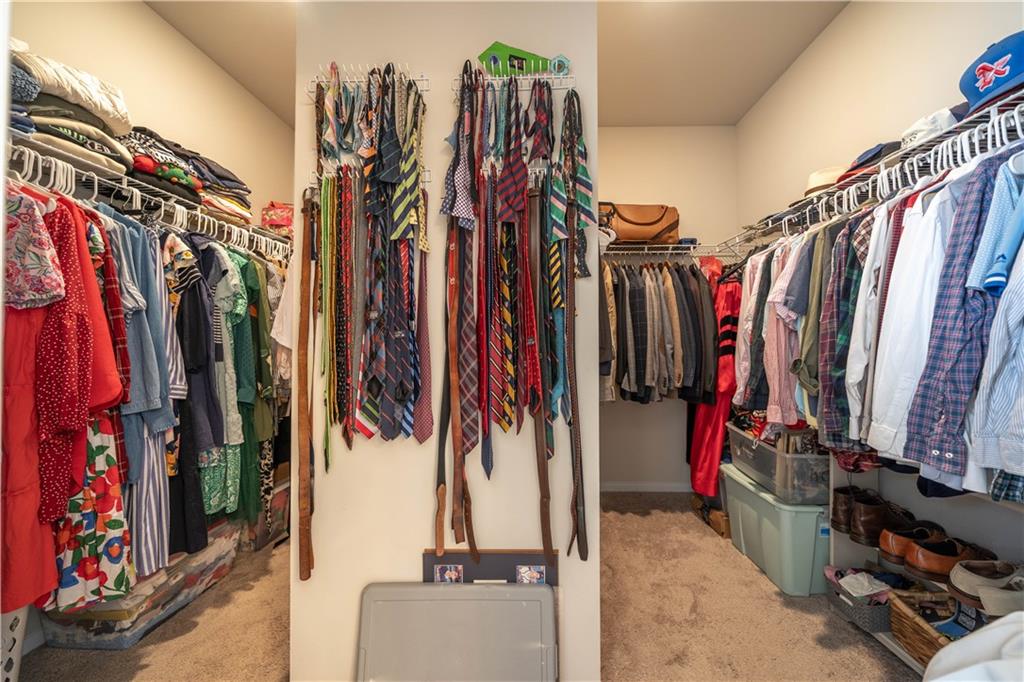 172 Mercer Lane Cartersville, GA 30120 - Photo 29 of 44 a view of walk in closet with clothes