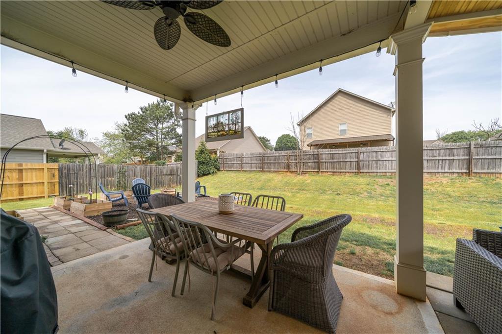 172 Mercer Lane Cartersville, GA 30120 - Photo 35 of 44 a view of a patio with a table chairs and a ocean view