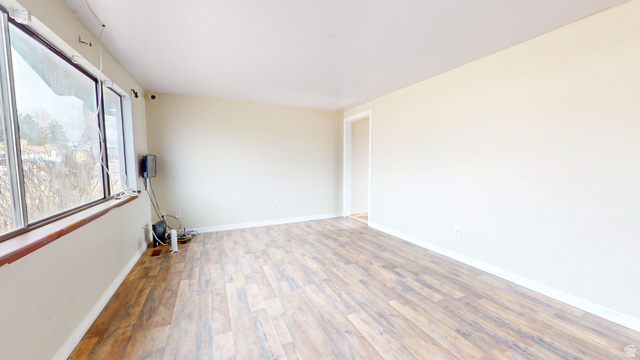1348 Sagewood Road Price, UT 84501 - Photo 2 of 34 Spare room featuring wood finished floors and baseboards