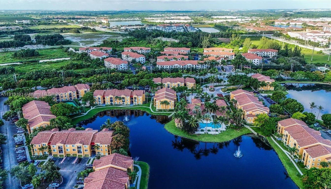 2120 West Preserve Way, Unit 307 Miramar, FL 33025 - Photo 11 of 20 an aerial view of residential houses with outdoor space and lake view