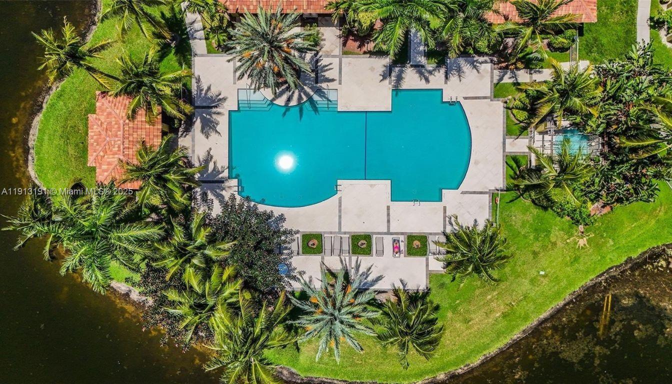 2120 West Preserve Way, Unit 307 Miramar, FL 33025 - Photo 12 of 20 an aerial view of a house with garden space and swimming pool
