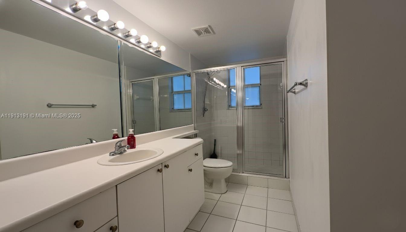 2120 West Preserve Way, Unit 307 Miramar, FL 33025 - Photo 6 of 20 a bathroom with a sink toilet and shower
