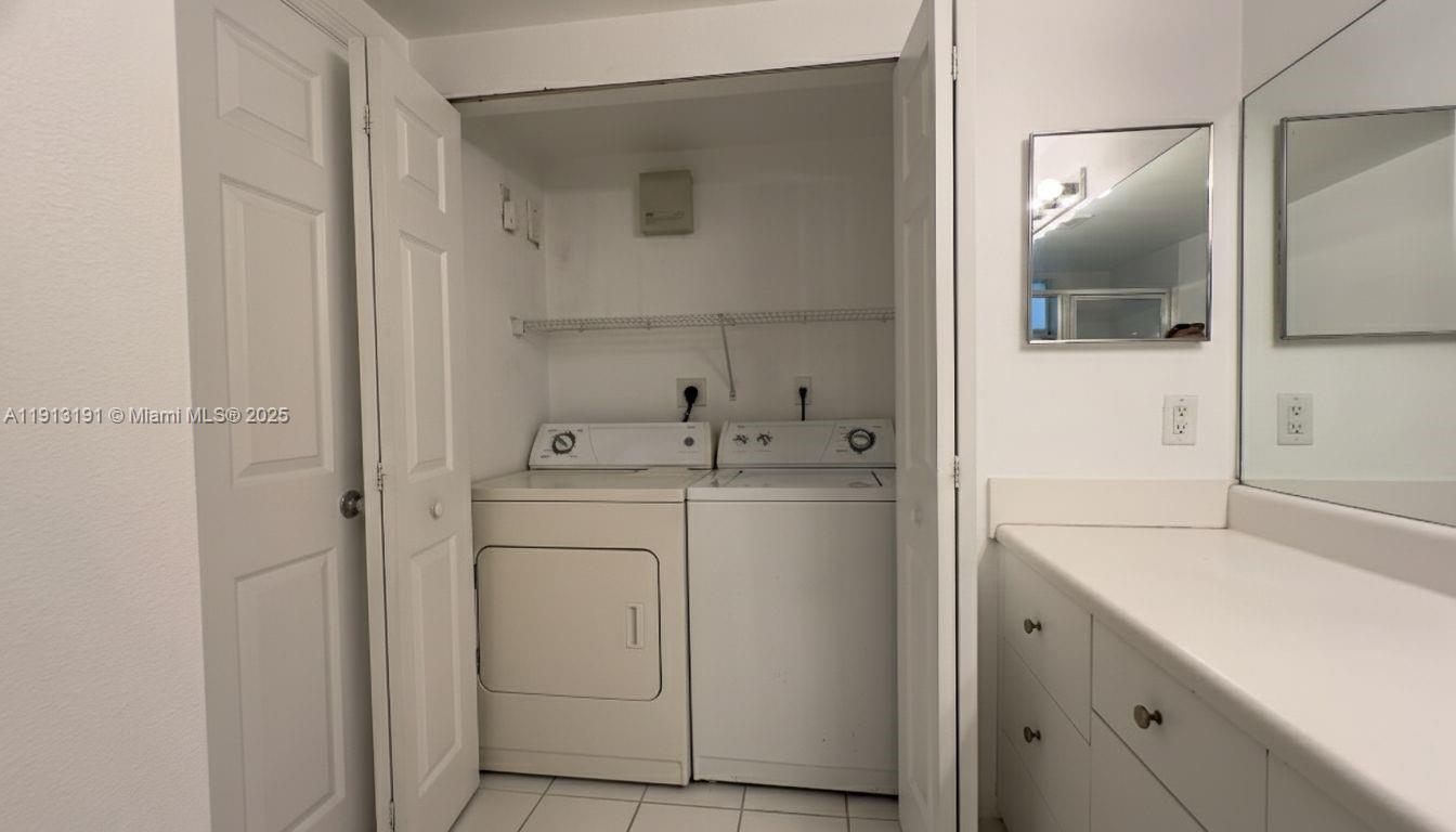 2120 West Preserve Way, Unit 307 Miramar, FL 33025 - Photo 7 of 20 a utility room with cabinets washer and dryer