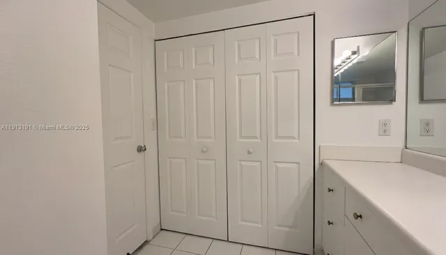 a bathroom with a sink and mirror