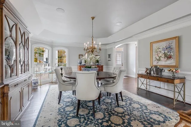 a kitchen with kitchen island a counter top space a sink stainless steel appliances and cabinets