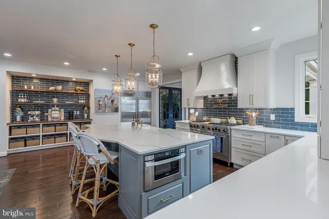 a living room with furniture fireplace and a large window