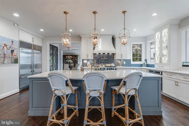 a view of a patio with couches and a fire pit