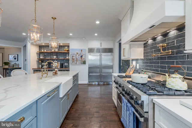 a view of a patio with couches and a table and chairs