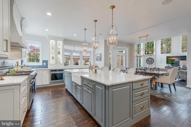 a living room with fireplace furniture and a wooden floor