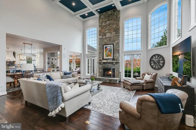 a large spacious bathroom with a double vanity sink a large mirror and a bathtub