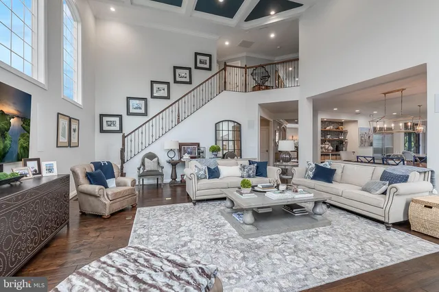 a bathroom with a toilet a sink a mirror a vanity and shower