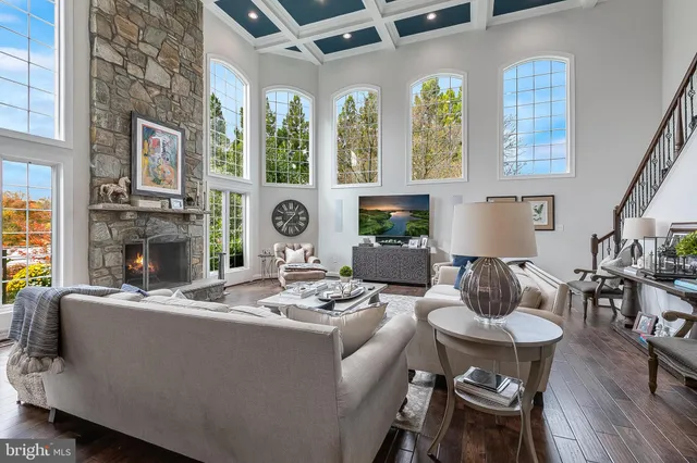 a bathroom with a granite countertop sink a toilet and a mirror
