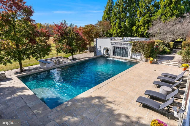 a view of a patio with table and chairs and potted plants