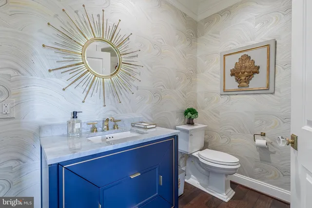 a view of back yard with swimming pool outdoor seating and trees in the background