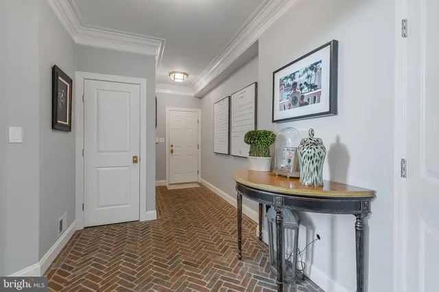 a view of a white house with a big yard and large trees