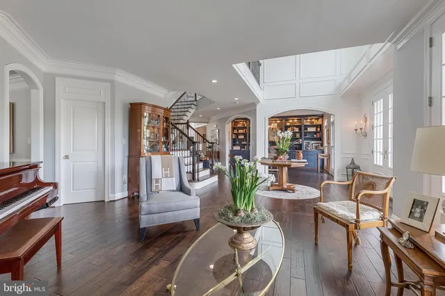 a room with patio furniture and a wooden floor