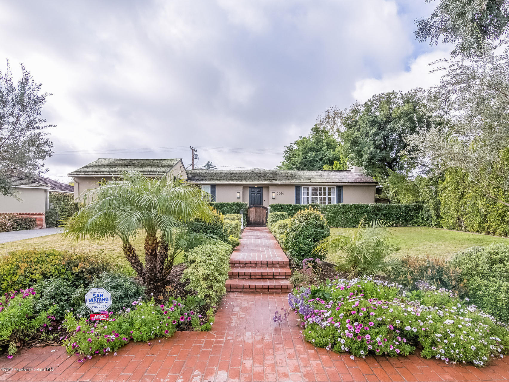 3564 Thorndale Road Pasadena, CA 91107 - Photo 1 of 24 a front view of a house with a yard and potted plants