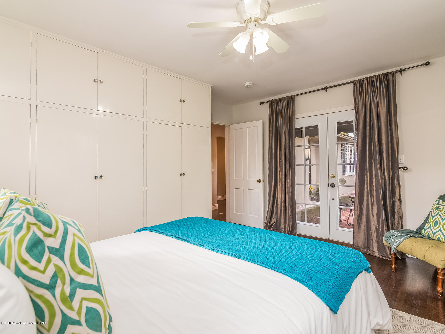 3564 Thorndale Road Pasadena, CA 91107 - Photo 15 of 24 a bedroom with a bed and a chandelier