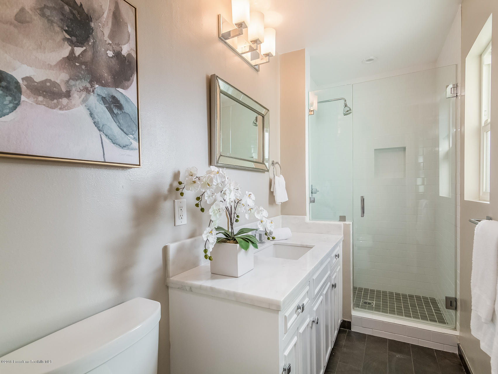 3564 Thorndale Road Pasadena, CA 91107 - Photo 16 of 24 a bathroom with a sink a mirror and a shower
