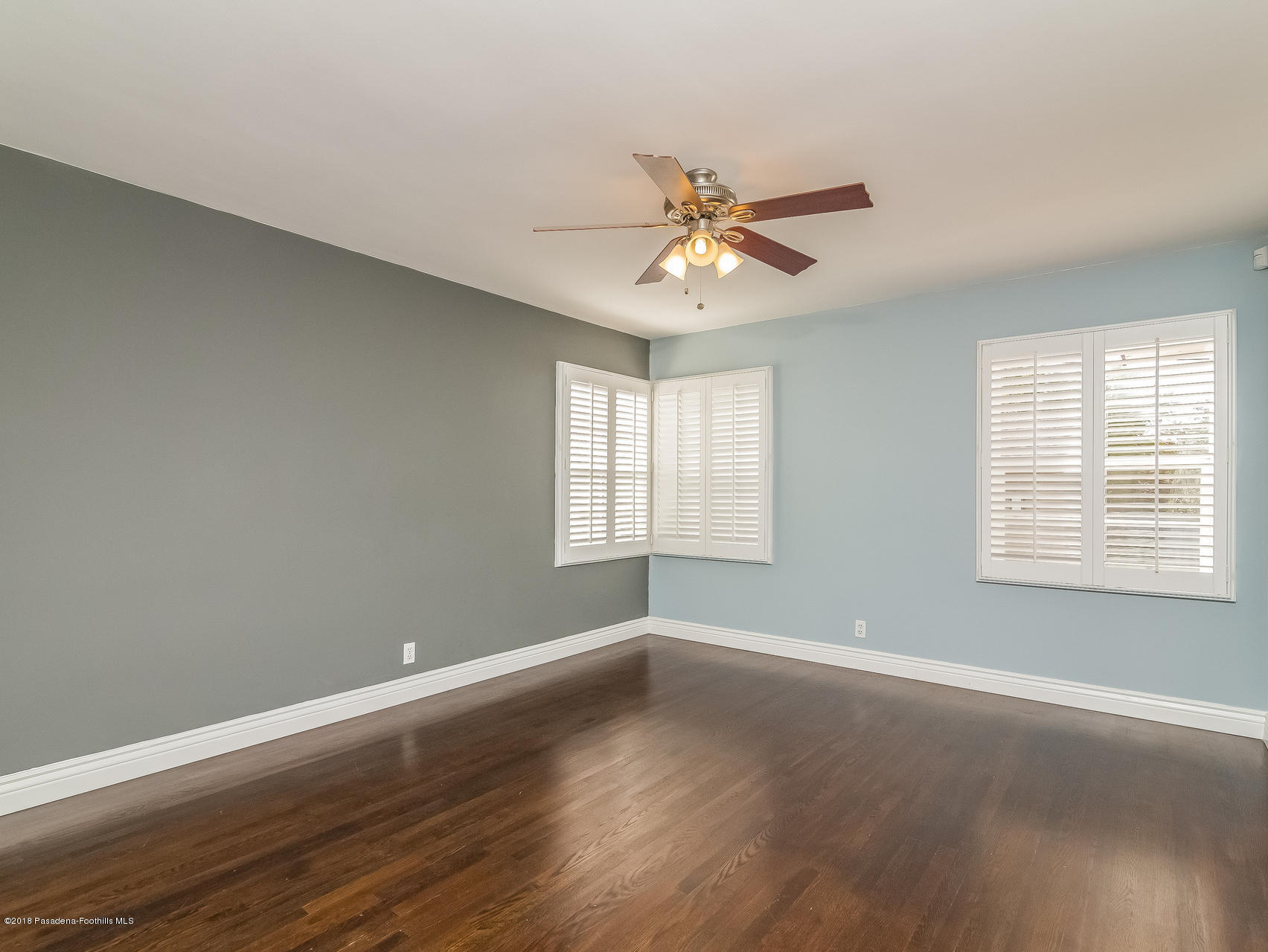 3564 Thorndale Road Pasadena, CA 91107 - Photo 17 of 24 a view of an empty room with wooden floor and a window