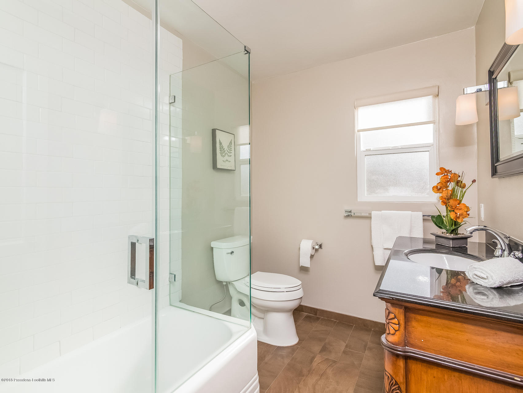 3564 Thorndale Road Pasadena, CA 91107 - Photo 18 of 24 a bathroom with a sink toilet and shower