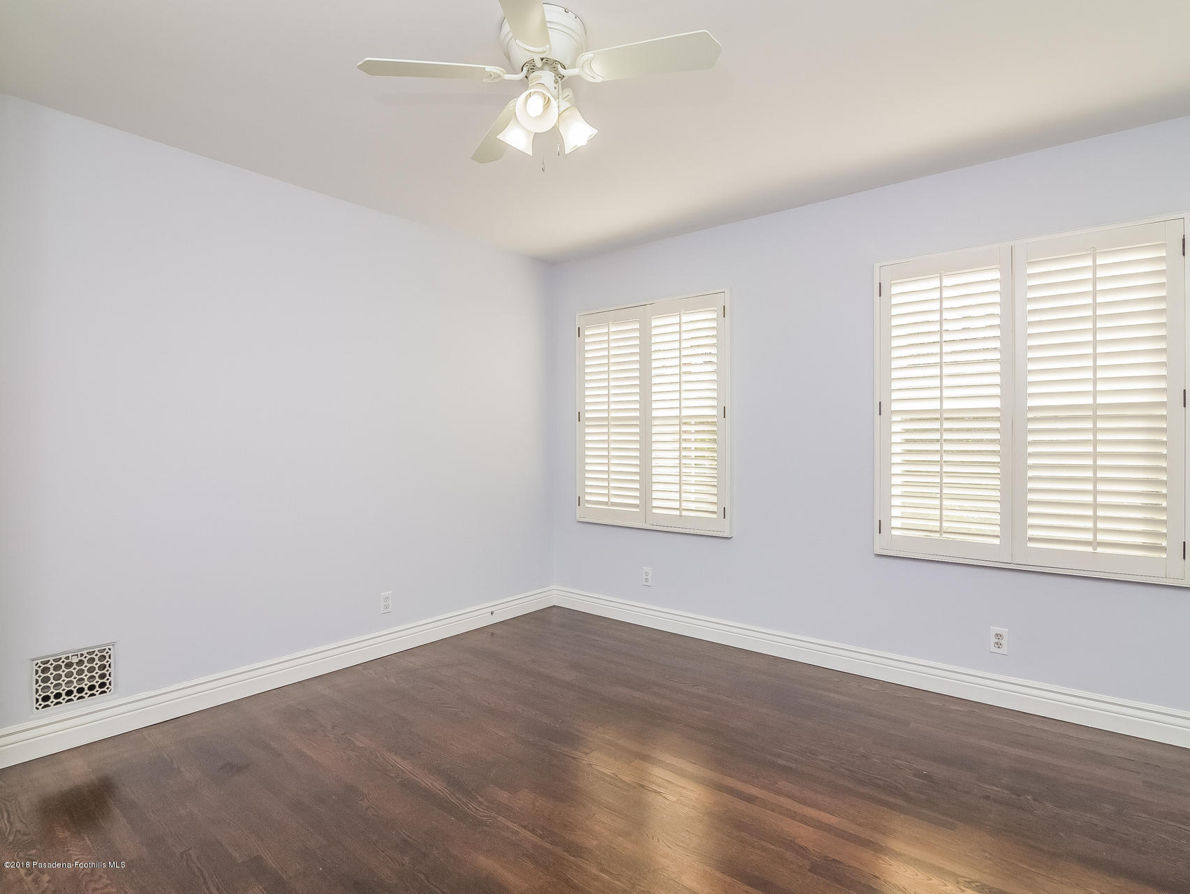3564 Thorndale Road Pasadena, CA 91107 - Photo 19 of 24 wooden floor in an empty room with a window