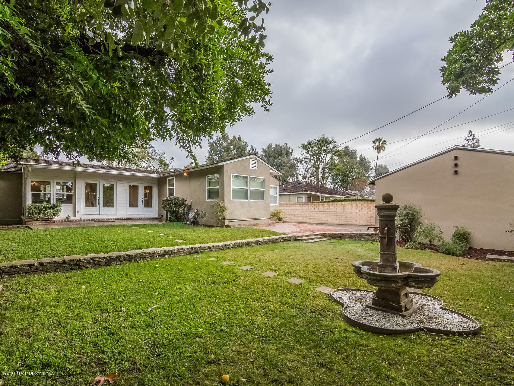 3564 Thorndale Road Pasadena, CA 91107 - Photo 21 of 24 a white house that has a tree in it