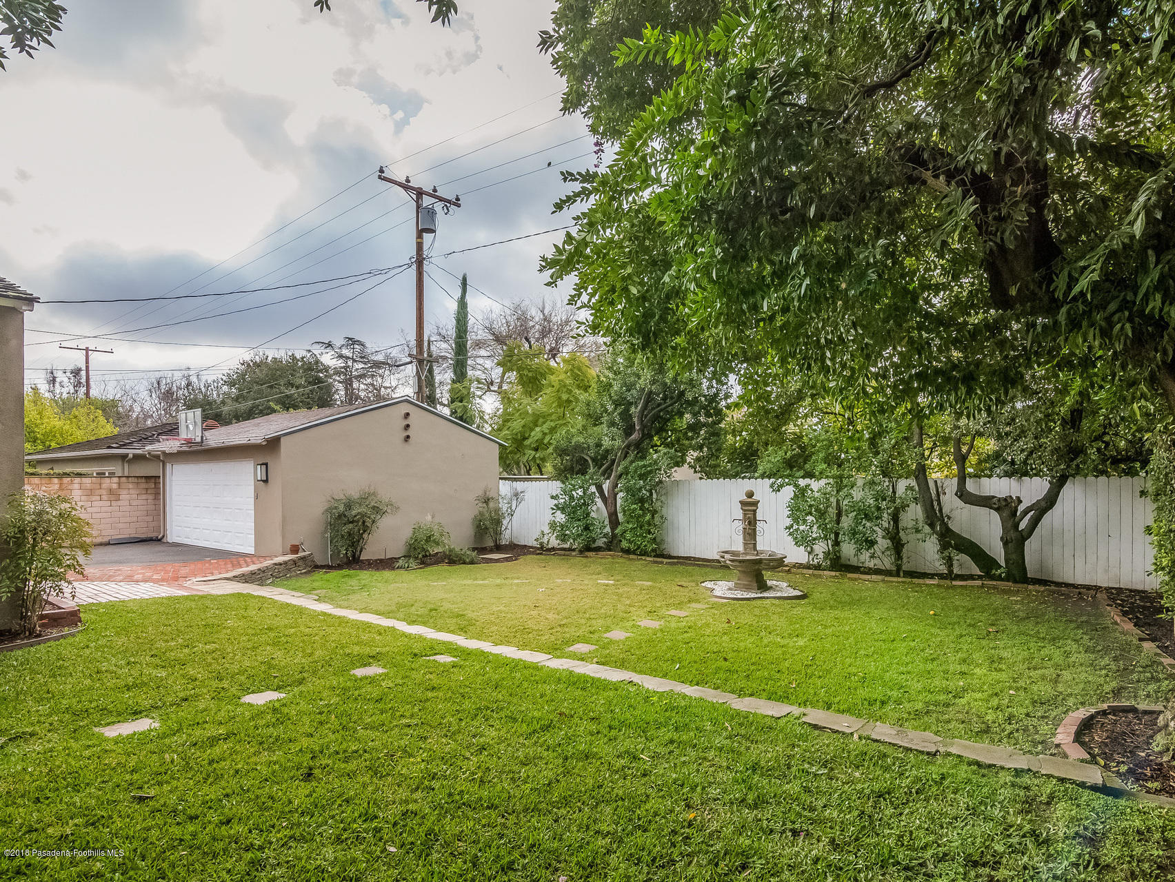 3564 Thorndale Road Pasadena, CA 91107 - Photo 22 of 24 a view of a house with backyard and tree