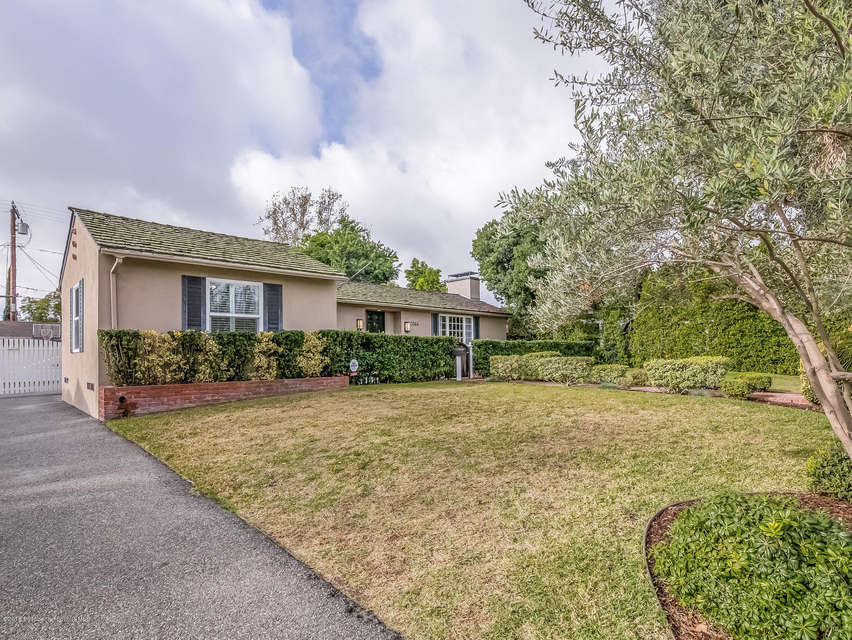 3564 Thorndale Road Pasadena, CA 91107 - Photo 24 of 24 a front view of a house with a yard and trees