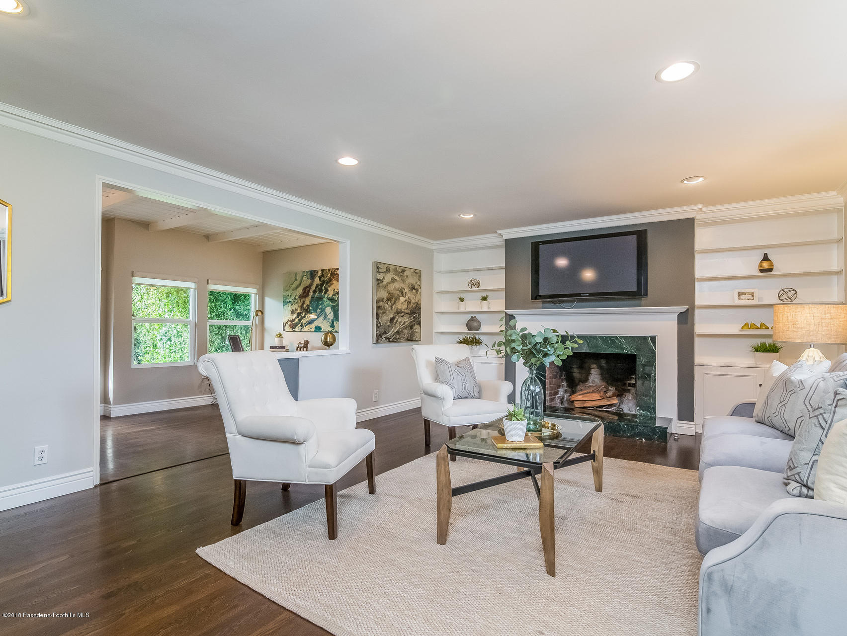 3564 Thorndale Road Pasadena, CA 91107 - Photo 5 of 24 a living room with furniture and a fireplace