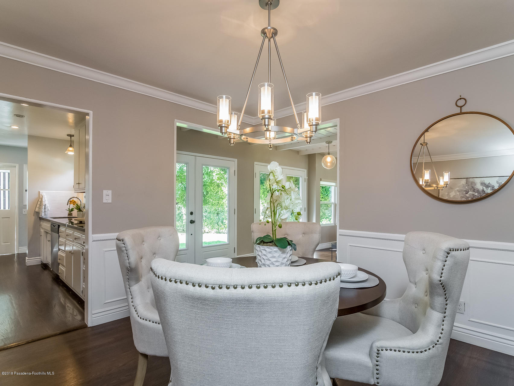 3564 Thorndale Road Pasadena, CA 91107 - Photo 9 of 24 a dining room with wooden floor a chandelier a wooden table and chairs