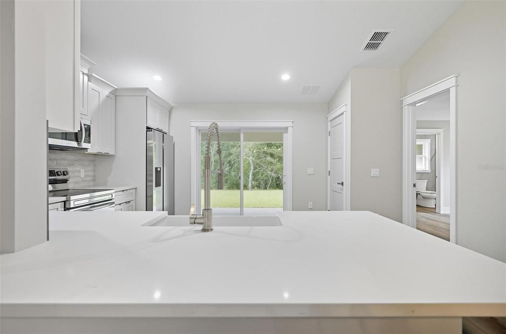 13 Fanshawe Lane Palm Coast, FL 32137 - Photo 14 of 60 a large white bed in a white room