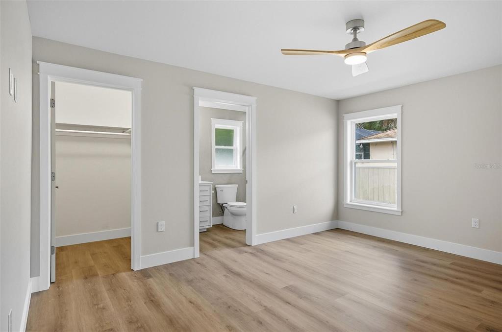 13 Fanshawe Lane Palm Coast, FL 32137 - Photo 20 of 60 a view of empty room with wooden floor and fan