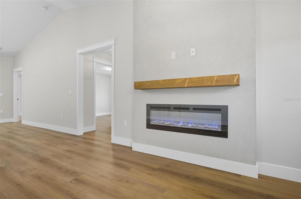 13 Fanshawe Lane Palm Coast, FL 32137 - Photo 29 of 60 a view of an empty room with wooden floor and a window