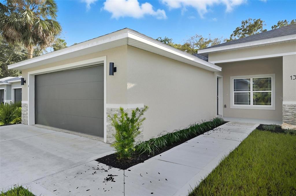 13 Fanshawe Lane Palm Coast, FL 32137 - Photo 43 of 60 a front view of house with yard