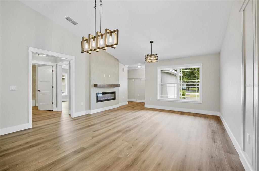 13 Fanshawe Lane Palm Coast, FL 32137 - Photo 5 of 60 a view of empty room with wooden floor and window