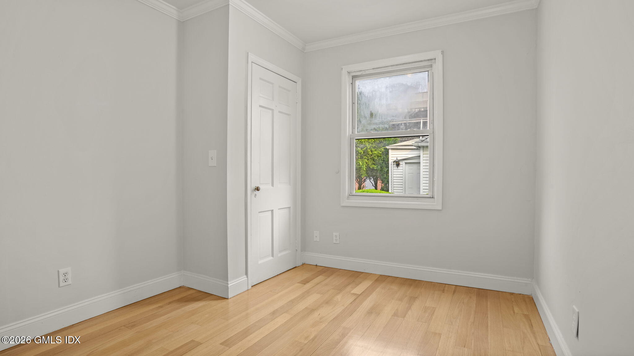 43 Church Street, Unit 1 Greenwich, CT 06830 - Photo 14 of 17 an empty room with window