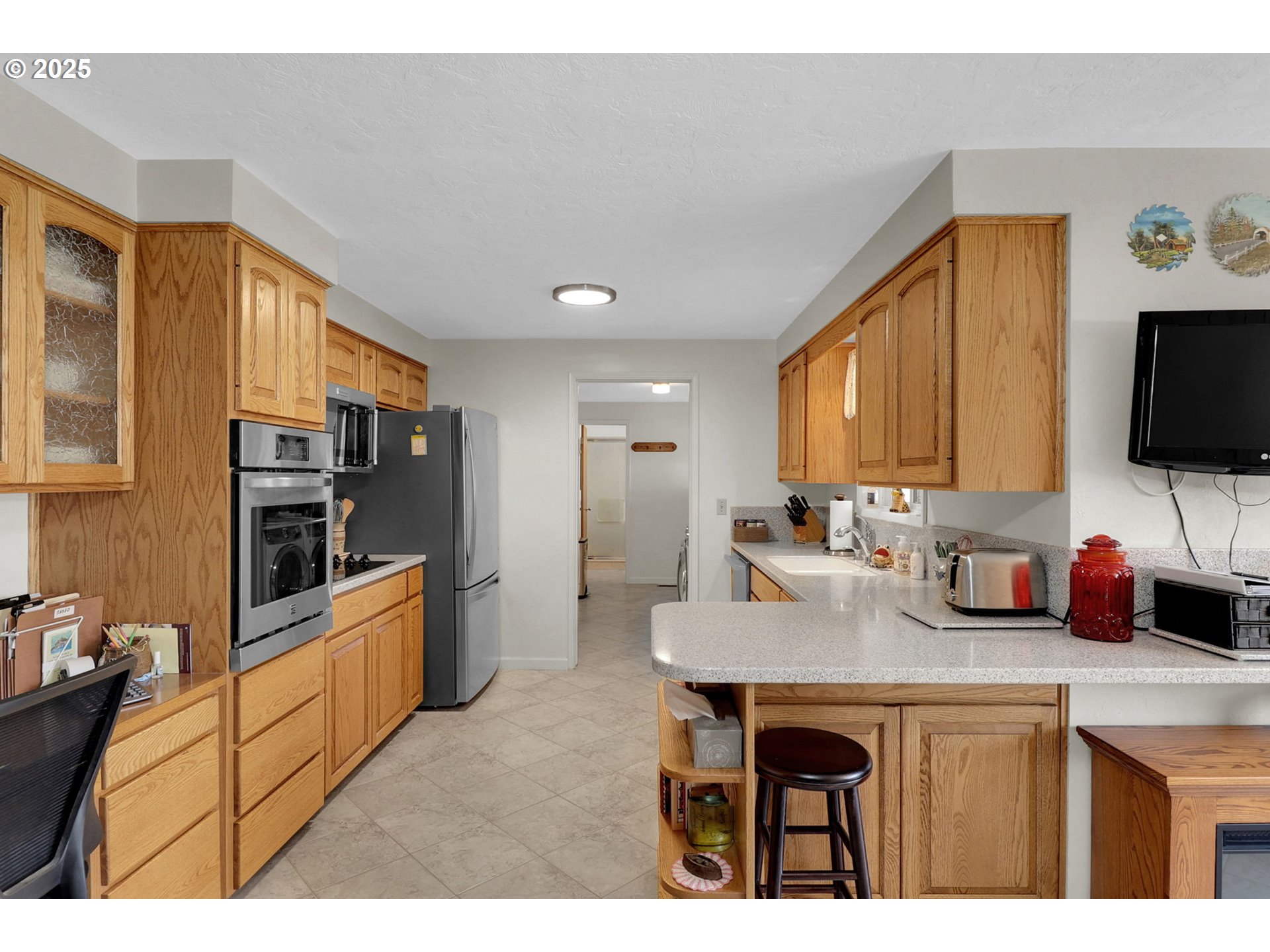1448 Cheek Street Springfield, OR 97477 - Photo 8 of 28 a kitchen with stainless steel appliances granite countertop a sink and cabinets