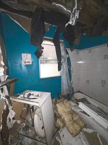 a balcony with table and chairs